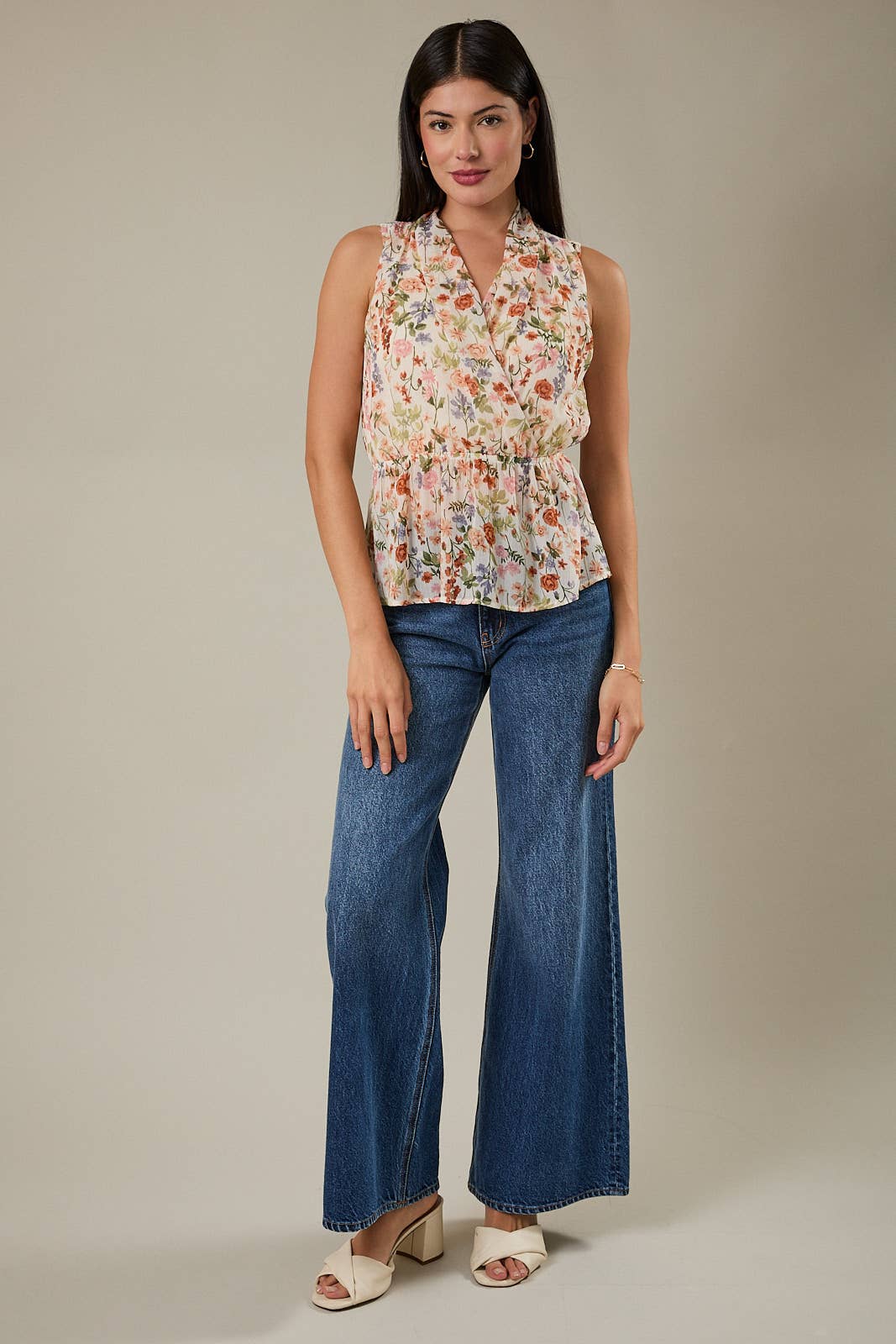 V NECK SLEEVELESS SURPLICE PEPLUM TOP