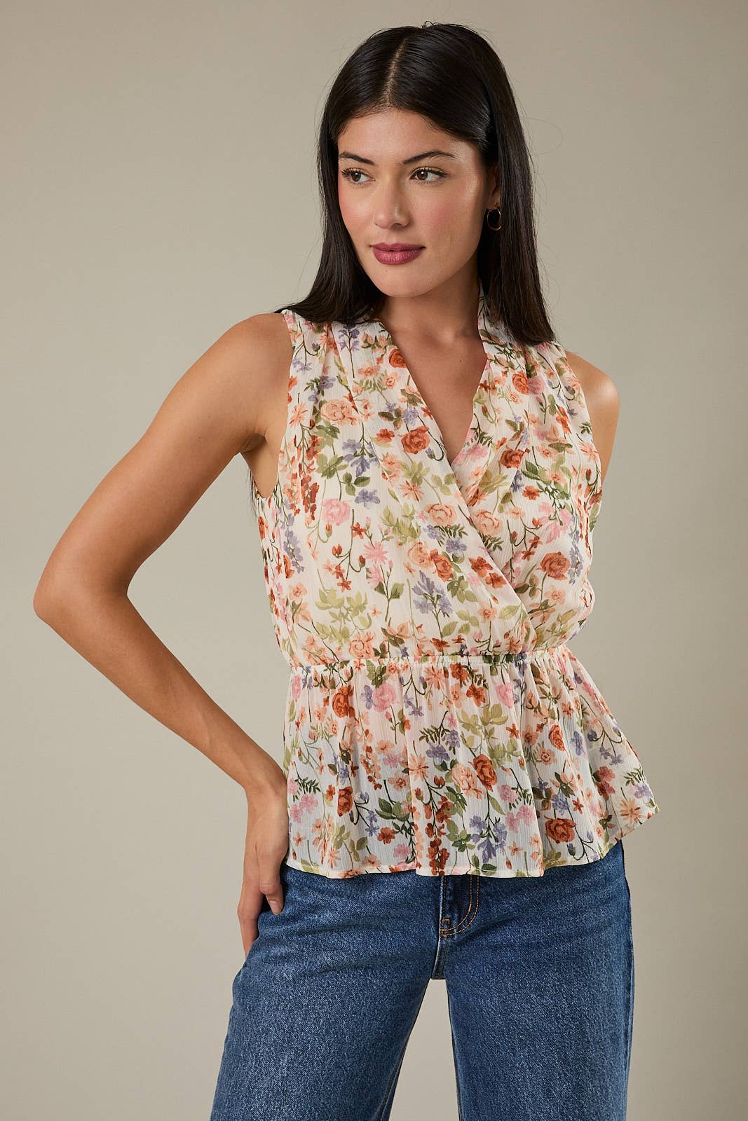 V NECK SLEEVELESS SURPLICE PEPLUM TOP